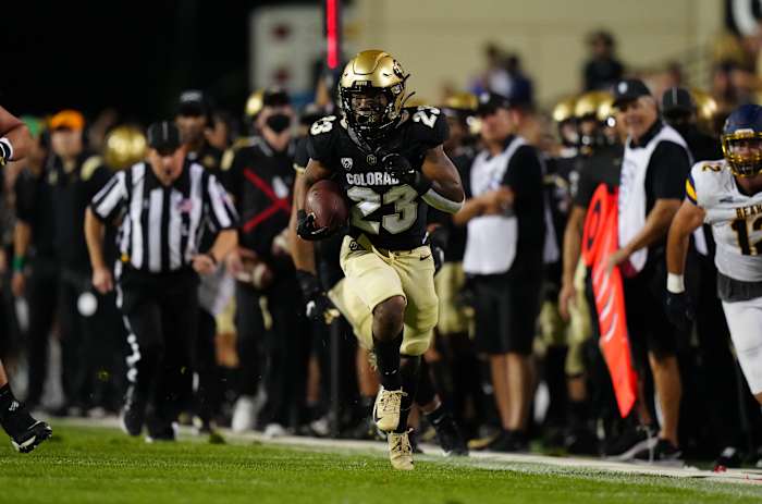 Colorado running back Jared Broussard (23) sprints along the sideline against Northern Colorado.